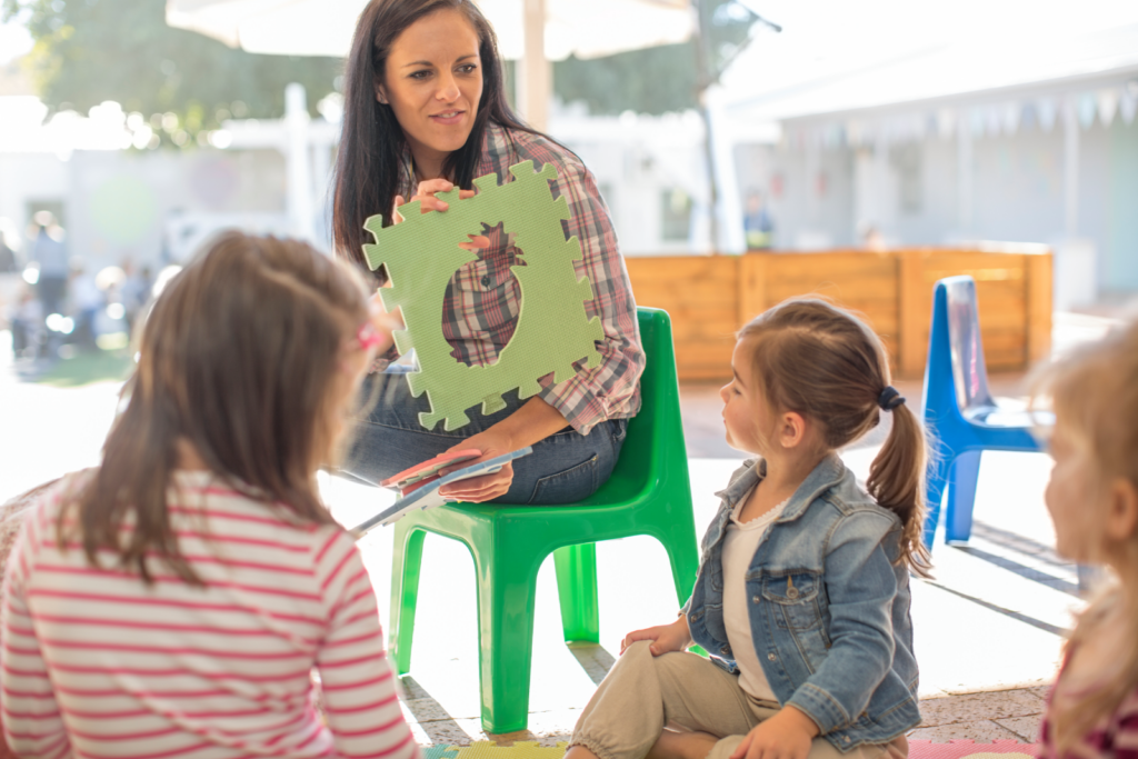 teacher-with-puzzle-piece-engaging-young-children-2026-01-09-10-41-00-utc